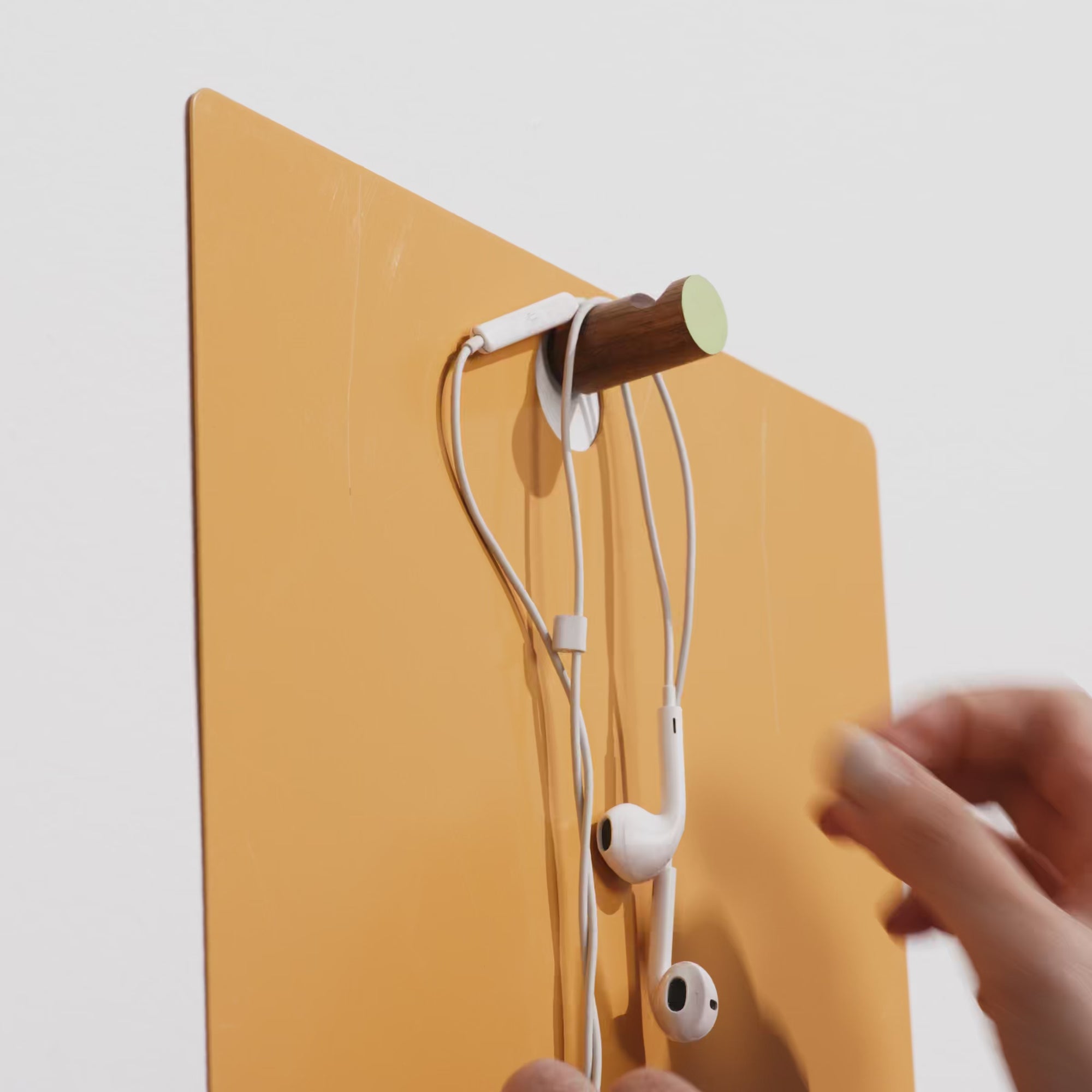The Magnetic Clipboard&nbsp;invites you to leave a note, keep a list, express yourself. Post this communication tool in an entryway, office or kitchen. Write directly on the metal board with a dry-erase pen or secure up to twenty sheets of paper with the magnetized wooden rod. Hang a pen or keys from the hook. In solid walnut and powder-coated metal.